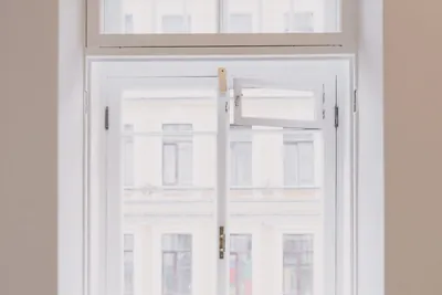 A newly fitted window with a screwdriver and cordless battery left on the sill